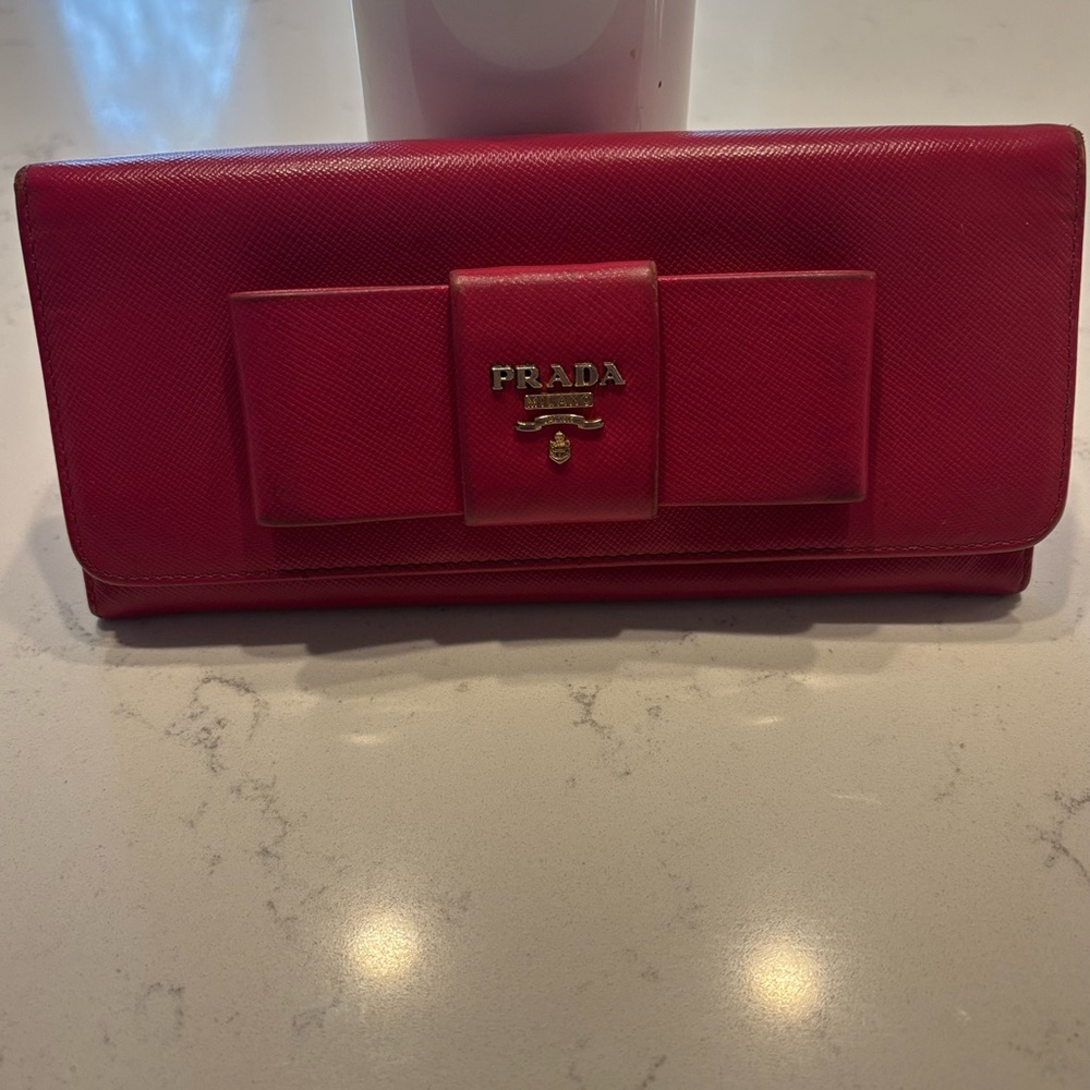Prada Pink Bow Wallet with Structured Design and Gold Logo